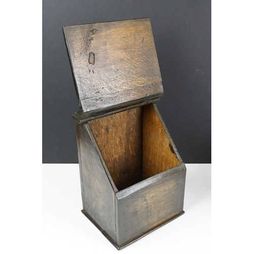 159 - Antique oak Welsh wall mounting salt box with hinge lid and wall bracket. Measures 41cm tall.