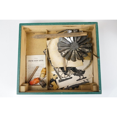 160 - 19th Century Victorian Gyrating Shadow Lantern in original box. The box containing screen, cut out f... 