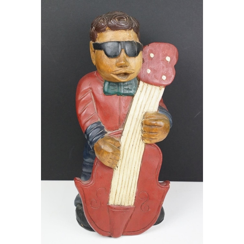 161 - Two carved wooden figures to include a double bass band player and golfer. Tallest measures 41cm tal... 