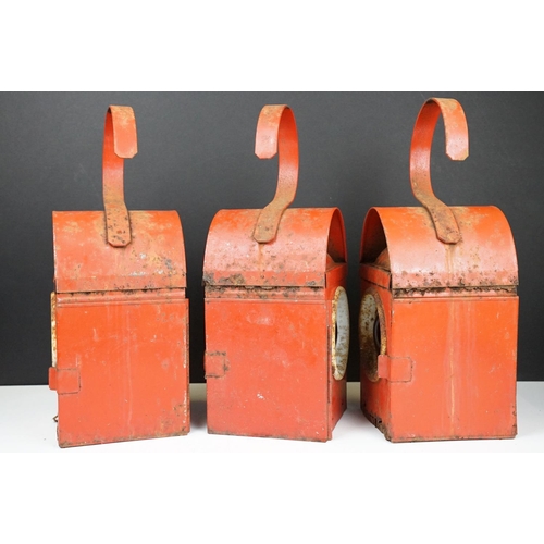 172 - Three Chalwyn roadside or railway lamps, each 38cm high