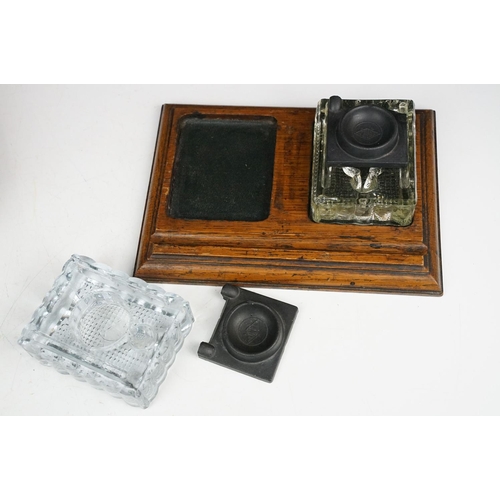 173A - Walnut box containing: an oak desk stand with two pressed glass inkwells, an Art Nouveau letter knif... 