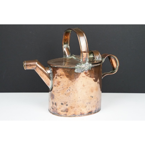 180 - Antique copper housekeepers watering can, 23cm high