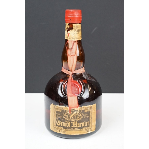 184 - Orange and Fine Old Grand Marnier Cognac Brandy liquor. 67.4% proof 24 2/3 fl oz. Sealed. Circa 1970... 