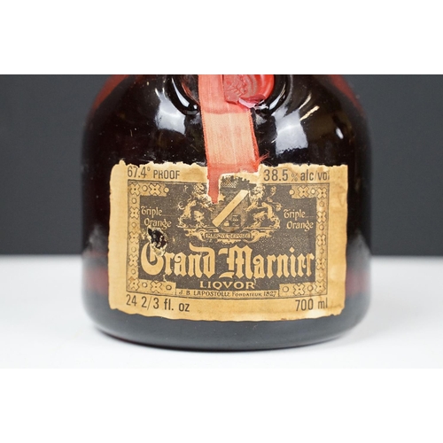 184 - Orange and Fine Old Grand Marnier Cognac Brandy liquor. 67.4% proof 24 2/3 fl oz. Sealed. Circa 1970... 