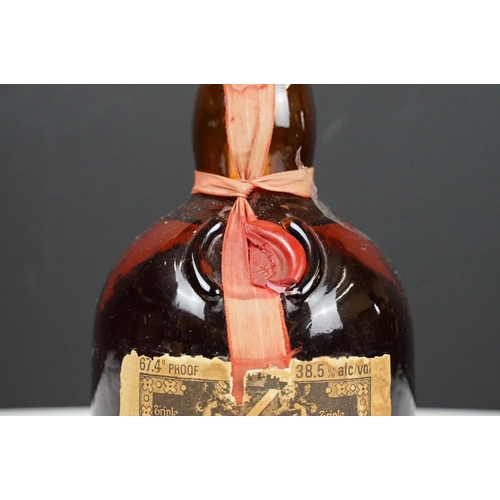 184 - Orange and Fine Old Grand Marnier Cognac Brandy liquor. 67.4% proof 24 2/3 fl oz. Sealed. Circa 1970... 