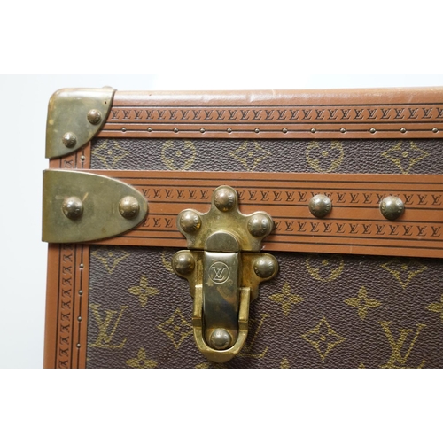 266 - Louis Vuitton - Monogrammed canvas travel trunk having branded leather banding, wooden slats, brass ... 