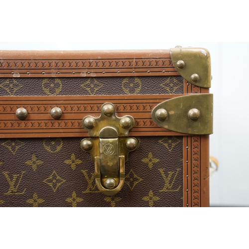 266 - Louis Vuitton - Monogrammed canvas travel trunk having branded leather banding, wooden slats, brass ... 