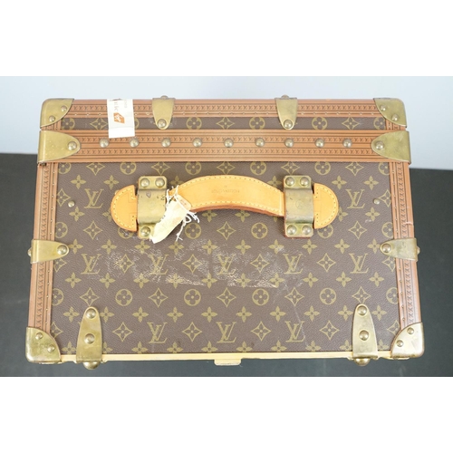 266 - Louis Vuitton - Monogrammed canvas travel trunk having branded leather banding, wooden slats, brass ... 