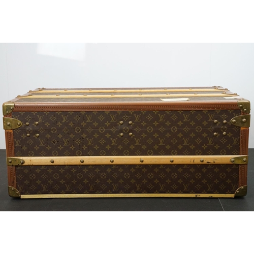 266 - Louis Vuitton - Monogrammed canvas travel trunk having branded leather banding, wooden slats, brass ... 