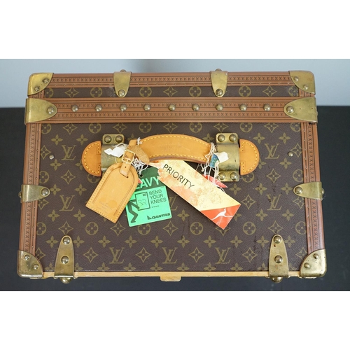 266 - Louis Vuitton - Monogrammed canvas travel trunk having branded leather banding, wooden slats, brass ... 