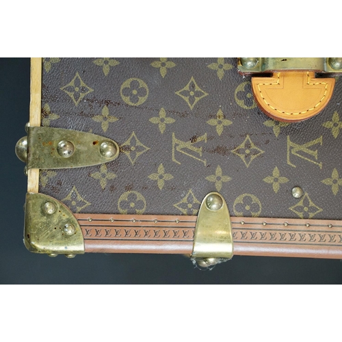 266 - Louis Vuitton - Monogrammed canvas travel trunk having branded leather banding, wooden slats, brass ... 