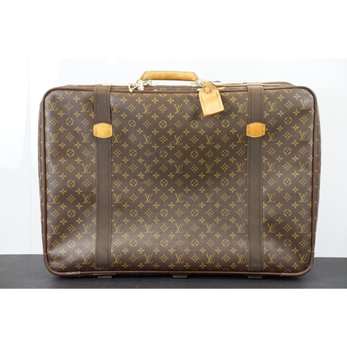 267 - Louis Vuitton - Satellite suitcase having a monogrammed body with two canvas straps and brown leathe... 