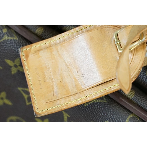 267 - Louis Vuitton - Satellite suitcase having a monogrammed body with two canvas straps and brown leathe... 