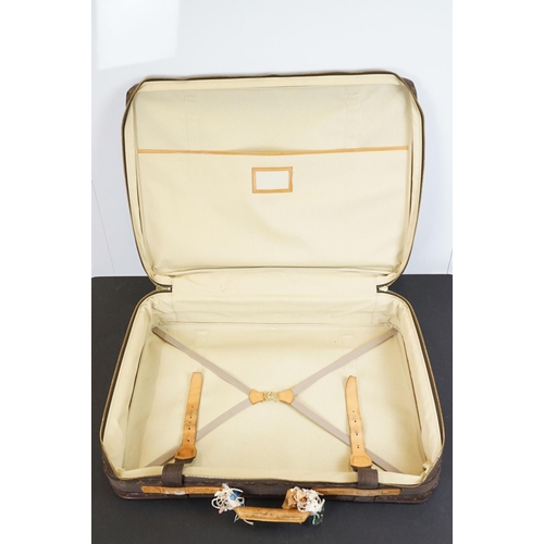 267 - Louis Vuitton - Satellite suitcase having a monogrammed body with two canvas straps and brown leathe... 