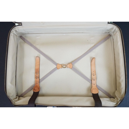 267 - Louis Vuitton - Satellite suitcase having a monogrammed body with two canvas straps and brown leathe... 