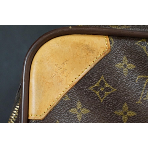 267 - Louis Vuitton - Satellite suitcase having a monogrammed body with two canvas straps and brown leathe... 