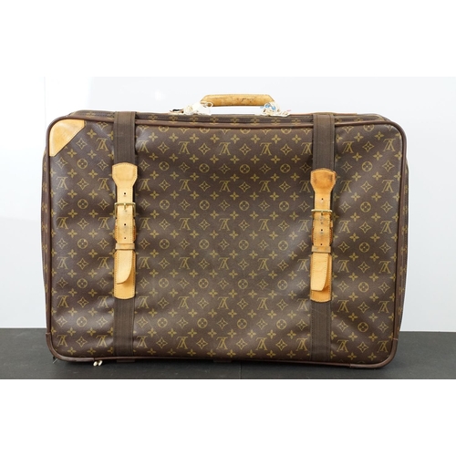 267 - Louis Vuitton - Satellite suitcase having a monogrammed body with two canvas straps and brown leathe... 