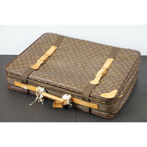 267 - Louis Vuitton - Satellite suitcase having a monogrammed body with two canvas straps and brown leathe... 