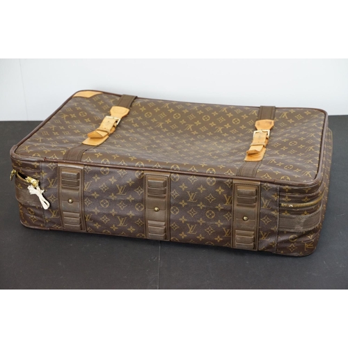 267 - Louis Vuitton - Satellite suitcase having a monogrammed body with two canvas straps and brown leathe... 