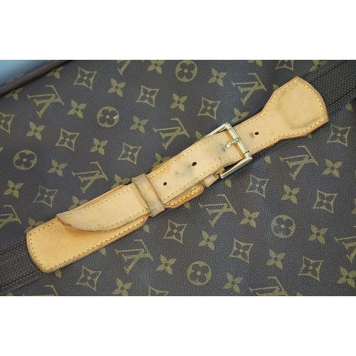 267 - Louis Vuitton - Satellite suitcase having a monogrammed body with two canvas straps and brown leathe... 