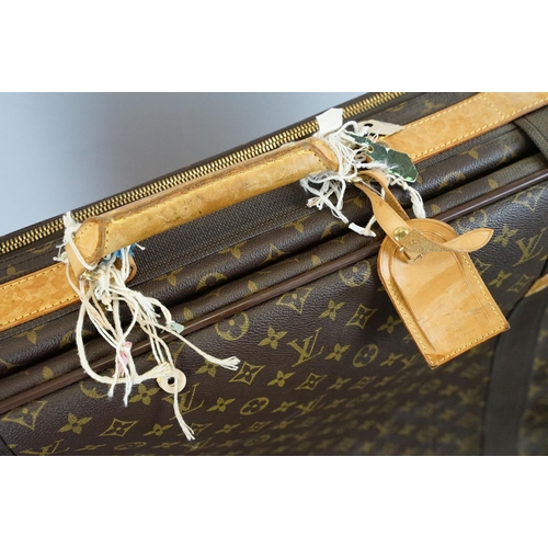 267 - Louis Vuitton - Satellite suitcase having a monogrammed body with two canvas straps and brown leathe... 