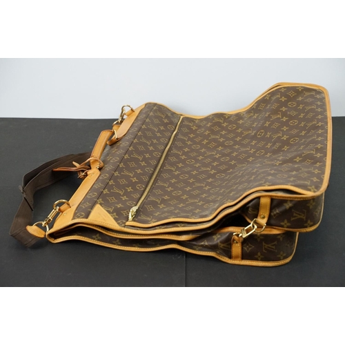 269 - Louis Vuitton - Garment bag having a monogrammed body with tanned leather handles and woven shoulder... 