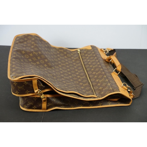 269 - Louis Vuitton - Garment bag having a monogrammed body with tanned leather handles and woven shoulder... 