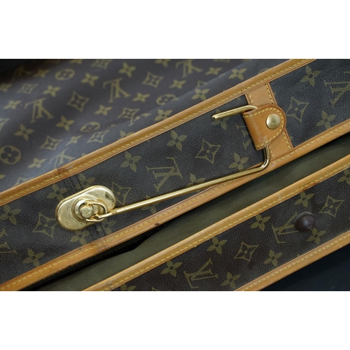 269 - Louis Vuitton - Garment bag having a monogrammed body with tanned leather handles and woven shoulder... 