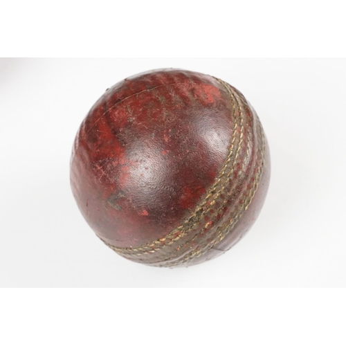 271 - Two Old 4 piece Red Leather Cricket Balls, largest 9cm diameter