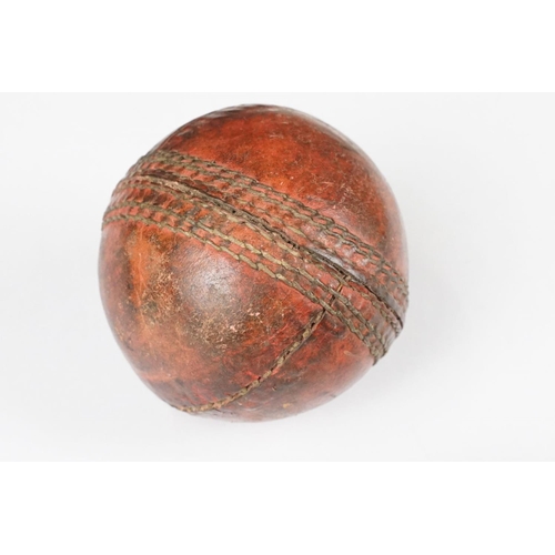 271 - Two Old 4 piece Red Leather Cricket Balls, largest 9cm diameter