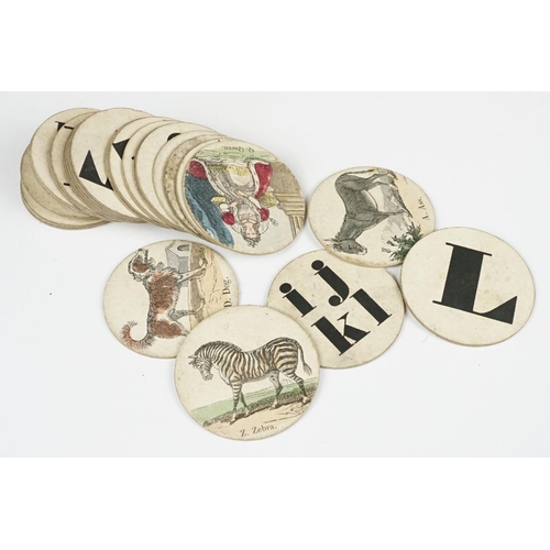 283 - Early 19th century picture alphabet, the discs with letters and hand coloured printed images to incl... 