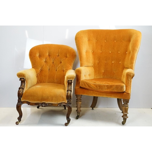 654 - Early 20th century wing back armchair of curved form, with button back, upholstered in orange, on tu... 