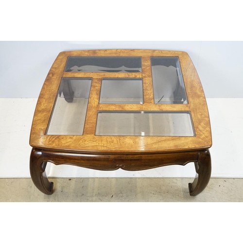 655 - Walnut coffee table, in the Oriental style, with five bevelled glass panels, 44cm high x 96.5cm wide... 