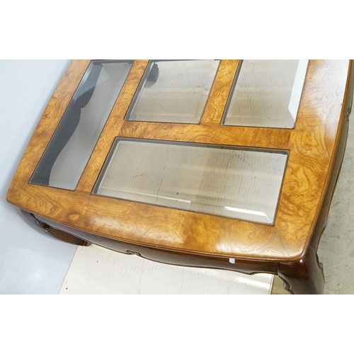 655 - Walnut coffee table, in the Oriental style, with five bevelled glass panels, 44cm high x 96.5cm wide... 