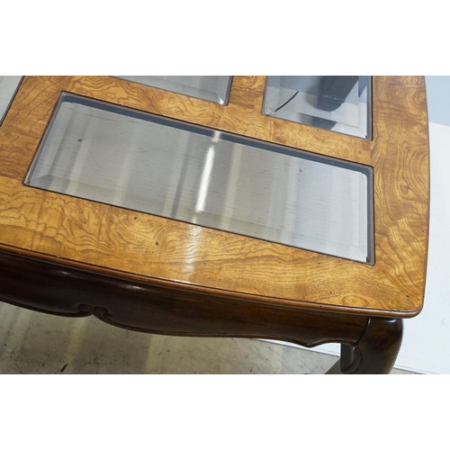 655 - Walnut coffee table, in the Oriental style, with five bevelled glass panels, 44cm high x 96.5cm wide... 