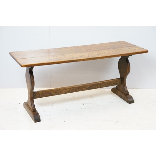 658A - Oak coffee table of stretchered form, 41cm high x 91cm wide x 32cm deep