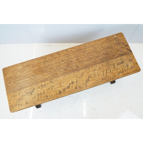 658A - Oak coffee table of stretchered form, 41cm high x 91cm wide x 32cm deep