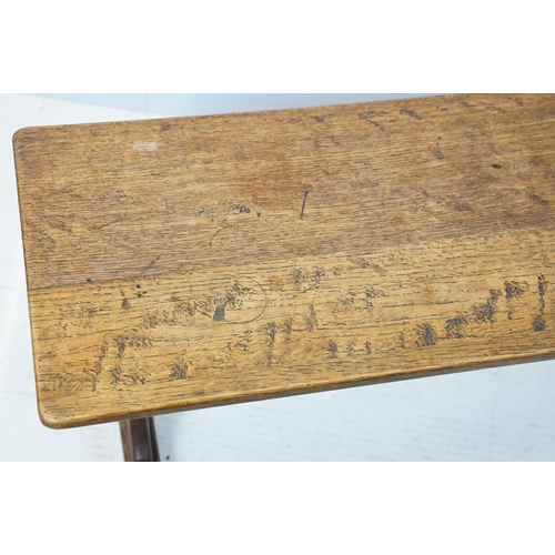 658A - Oak coffee table of stretchered form, 41cm high x 91cm wide x 32cm deep