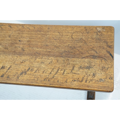 658A - Oak coffee table of stretchered form, 41cm high x 91cm wide x 32cm deep