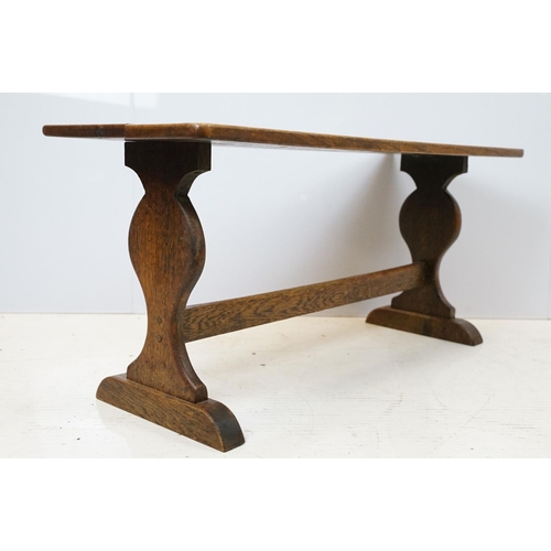 658A - Oak coffee table of stretchered form, 41cm high x 91cm wide x 32cm deep