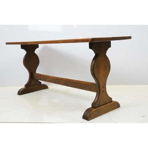 658A - Oak coffee table of stretchered form, 41cm high x 91cm wide x 32cm deep