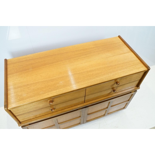 660 - Nathan Furniture teak side units, one comprising an arrangement of four drawers above two panelled d... 