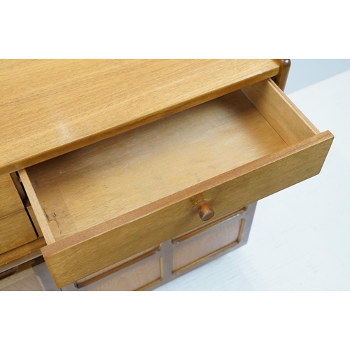 660 - Nathan Furniture teak side units, one comprising an arrangement of four drawers above two panelled d... 