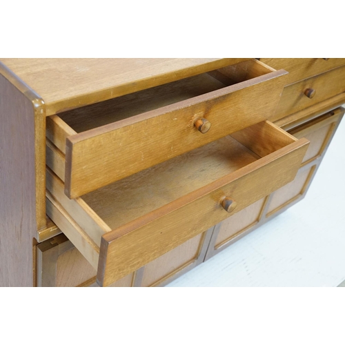 660 - Nathan Furniture teak side units, one comprising an arrangement of four drawers above two panelled d... 