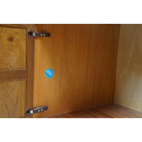 660 - Nathan Furniture teak side units, one comprising an arrangement of four drawers above two panelled d... 