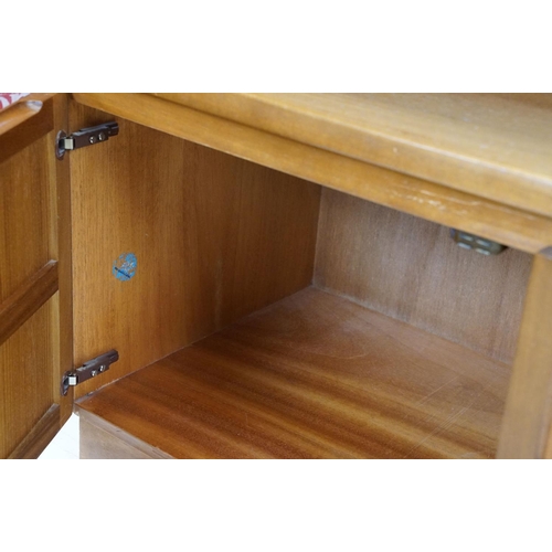 660 - Nathan Furniture teak side units, one comprising an arrangement of four drawers above two panelled d... 