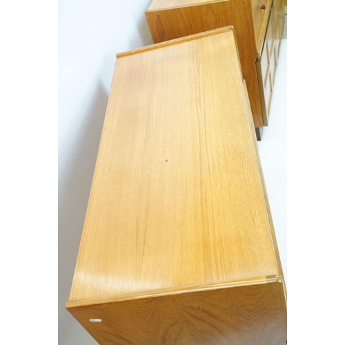 660 - Nathan Furniture teak side units, one comprising an arrangement of four drawers above two panelled d... 