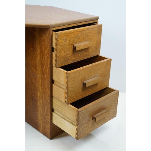 671 - 20th century oak kneehole desk, with a hexagonal top over an arrangement of six drawers, 62cm high x... 