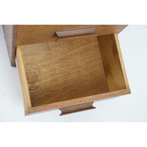 671 - 20th century oak kneehole desk, with a hexagonal top over an arrangement of six drawers, 62cm high x... 