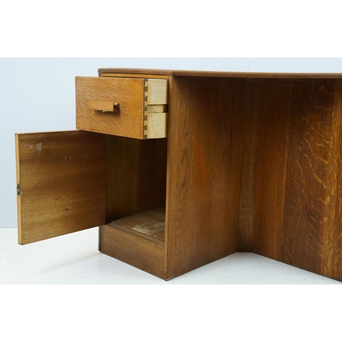 671 - 20th century oak kneehole desk, with a hexagonal top over an arrangement of six drawers, 62cm high x... 